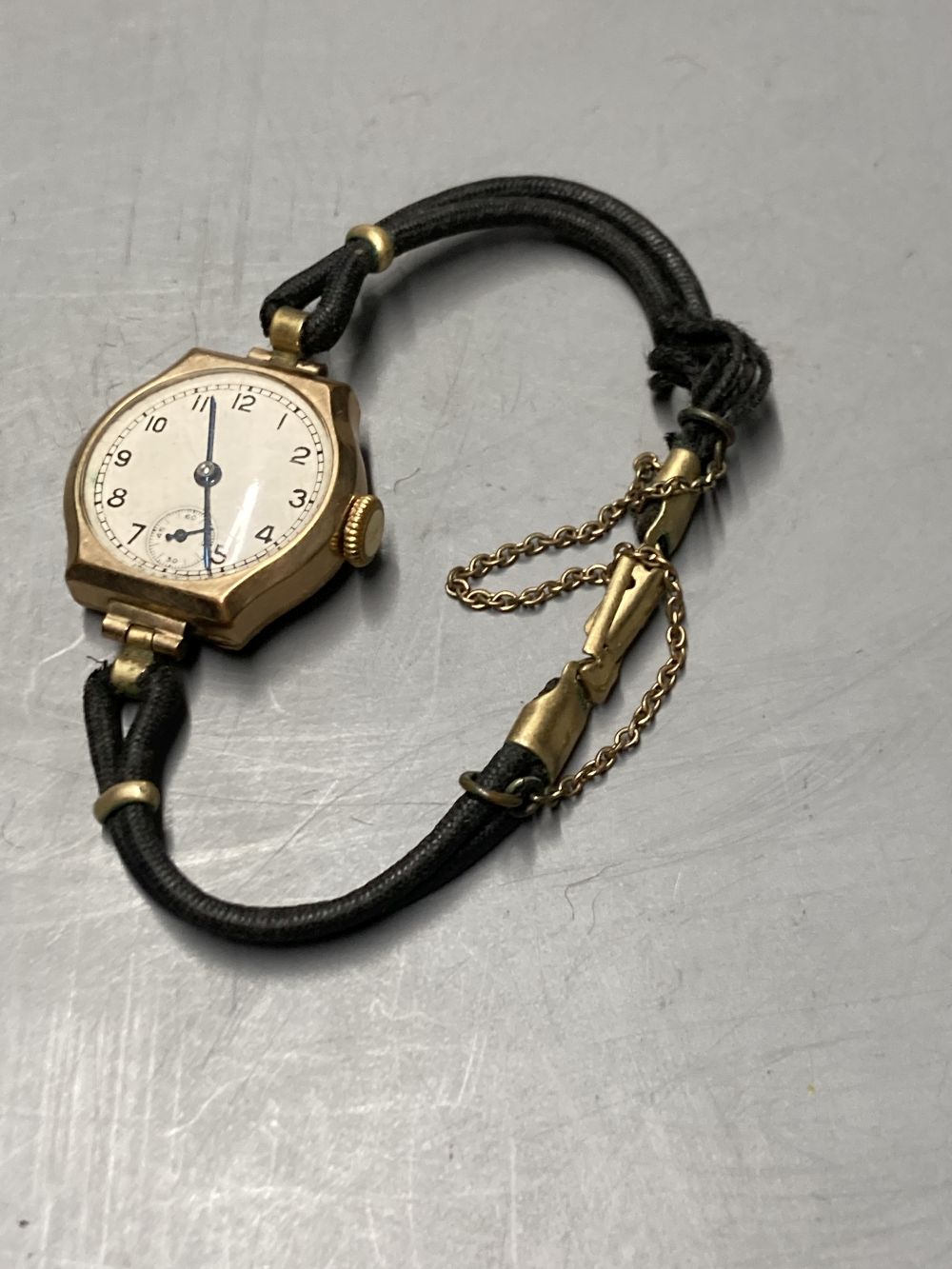 A 9ct gold vintage wristwatch with circular dial and subsidiary seconds dial (converted) and three other 9ct gold watches,